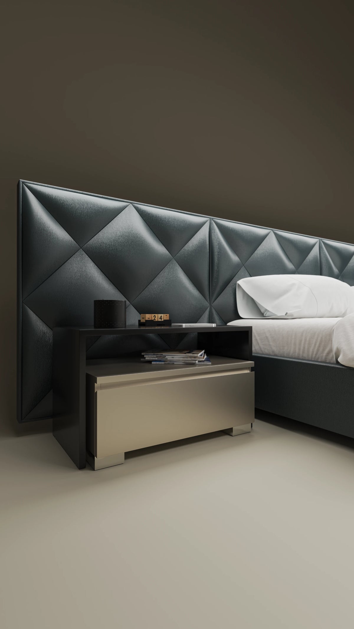 Close-up of the Diamond bed’s dark grey upholstered diamond-panel cladding and integrated two-tone nightstand.
