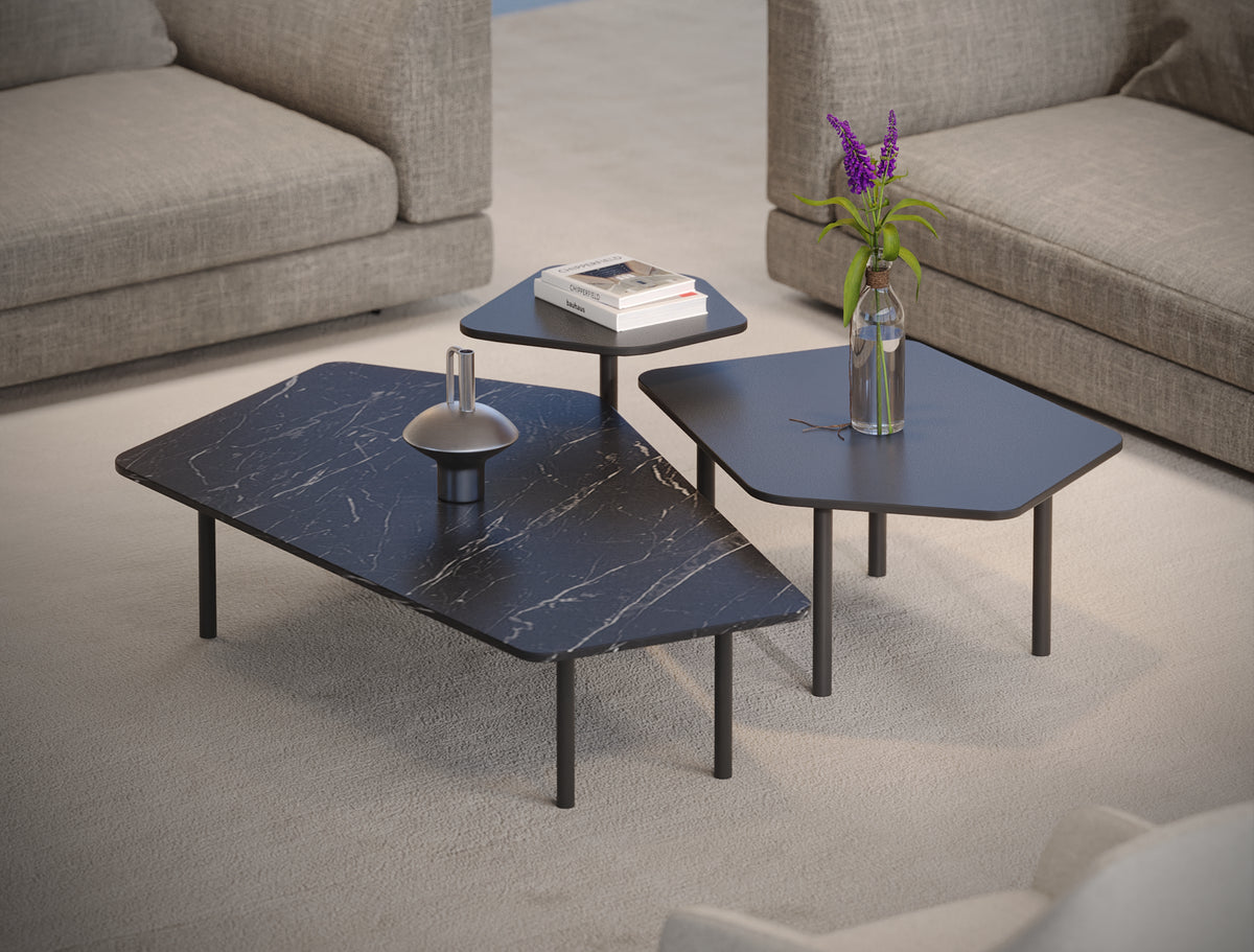 Three Echo tables in different shapes, sizes, and heights, featuring black marble laminate and painted tops with slim metal legs.