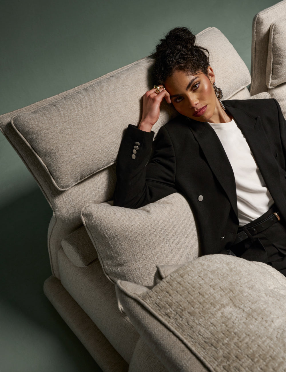 Flexor sofa with tilted headrest for relaxed lounging in beige fabric.