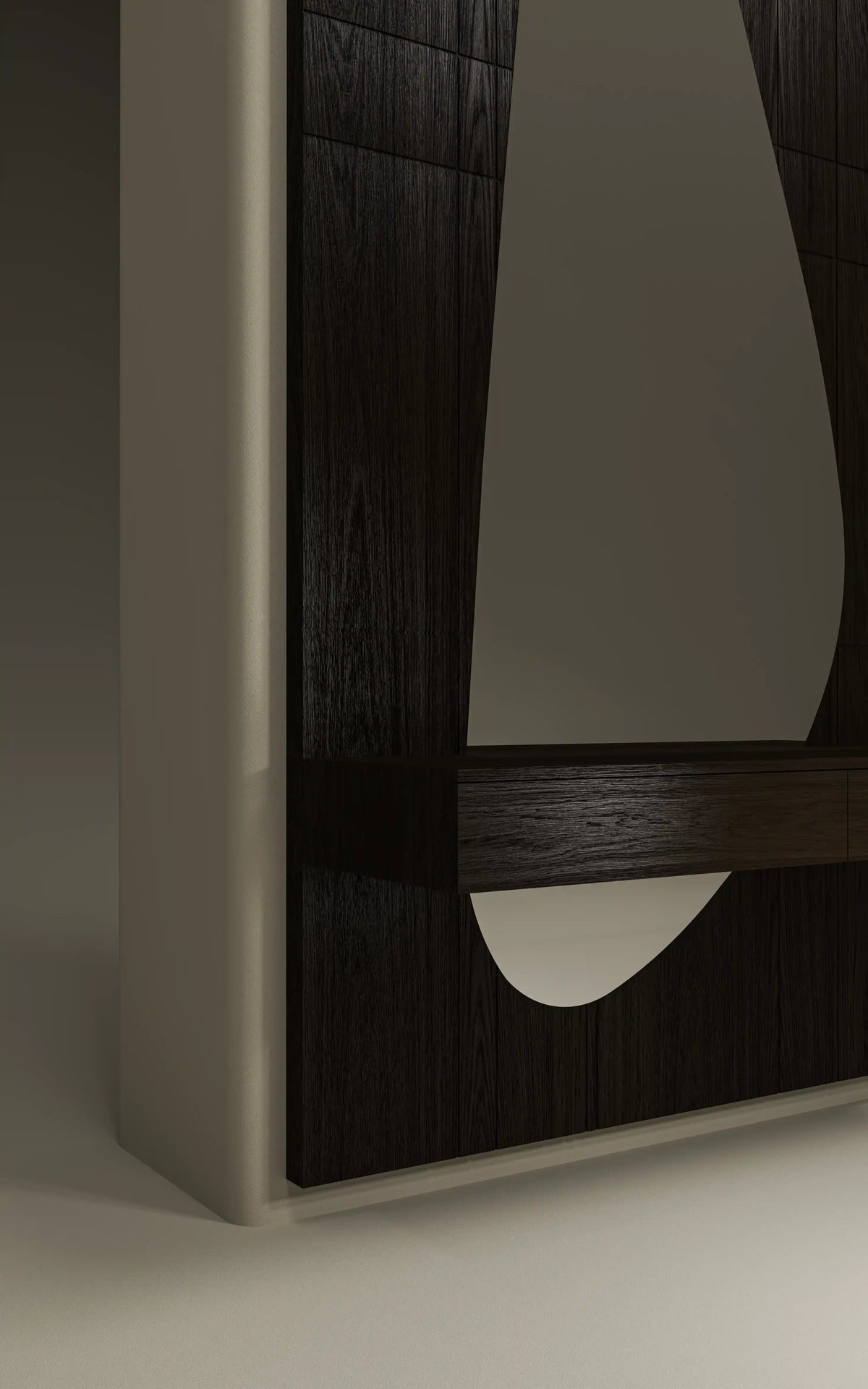 Close-up of the Halo dresser highlighting its freeform mirror, carved wood grain, and elevated drawer with a concealed handle.
