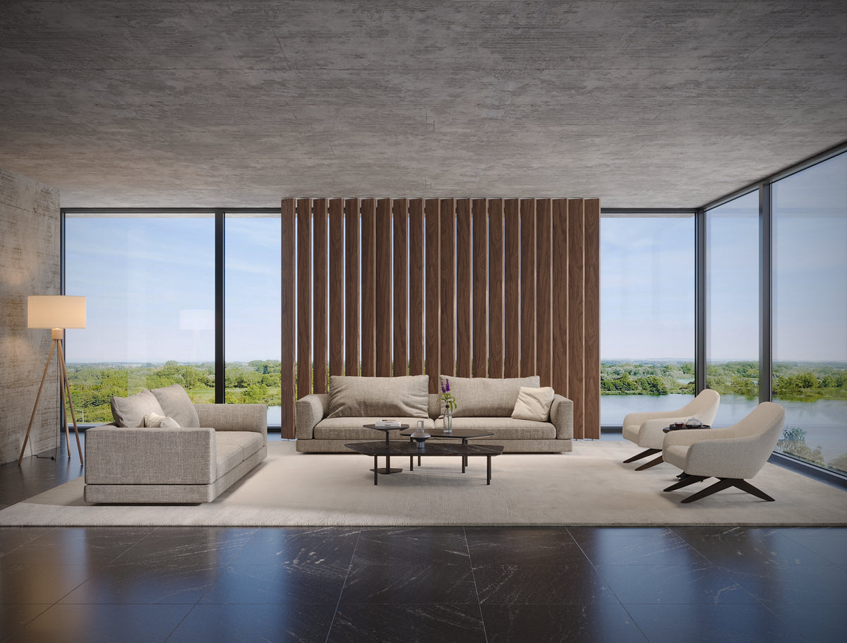 Beige Monti sofas arranged in a modern living room with generous seat cushions, soft back cushions, and upholstered armrests.