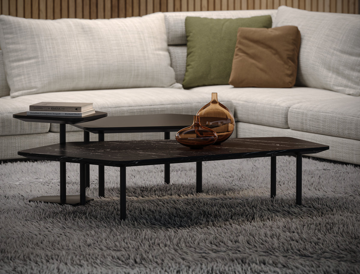 Close-up of the white Monti sectional sofa, showing its curved corner module, deep seat cushions, and feather-filled back cushions.