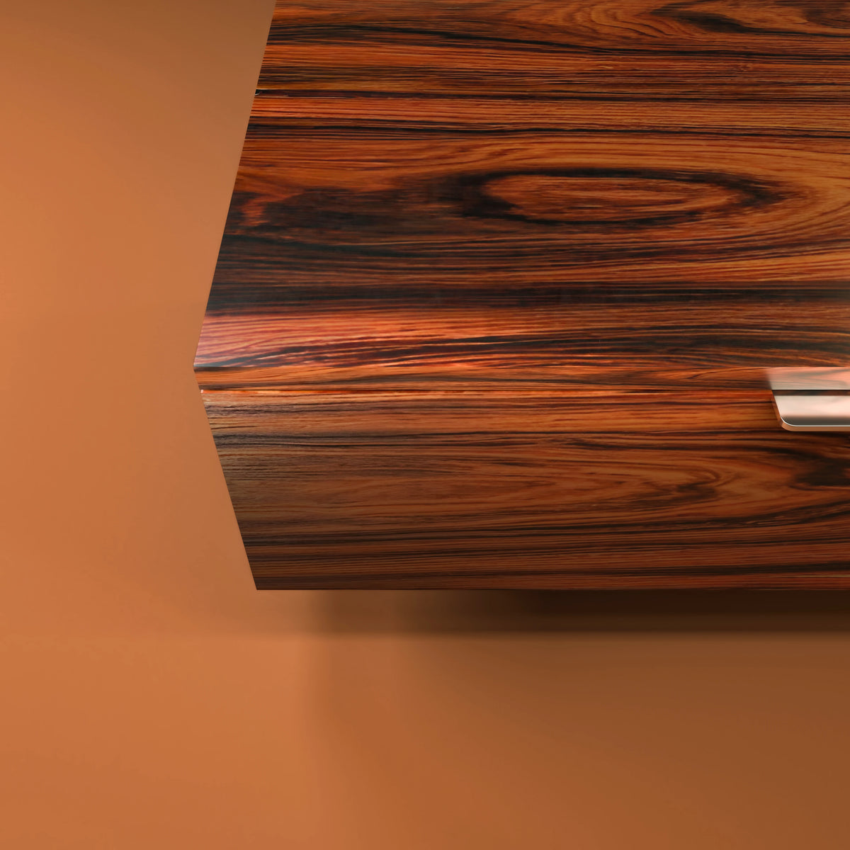 Close-up of the Pali Nightstand highlighting the rich tonal variation and directional grain of its palisander veneer finish.