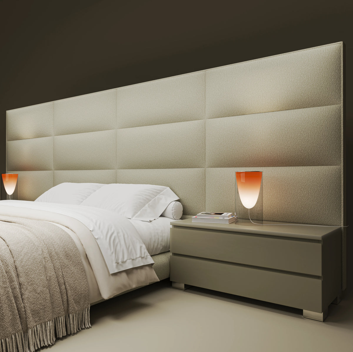 Close angled view of the beige Platinum bed with extended bombé cladding and a matching two-drawer nightstand.