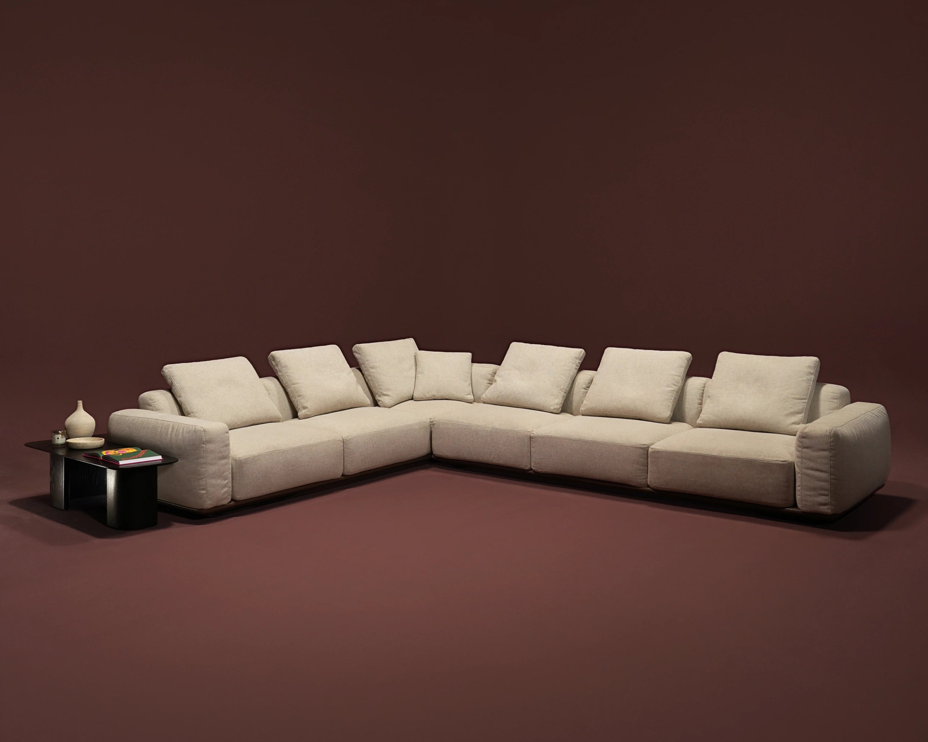 Beige Soffio corner sofa with deep seating, tall seat cushions, and loose duck feather-filled back cushions.