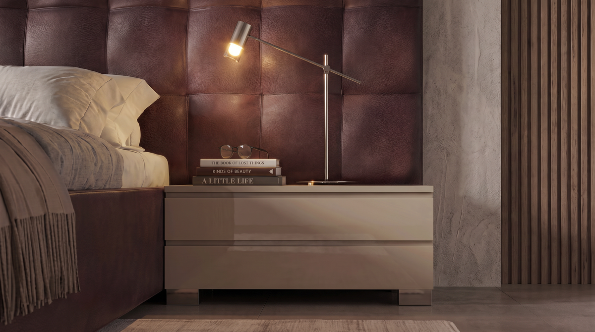 Close-up of the Square bed’s burgundy grid cladding and matching two-drawer nightstand with a bedside lamp.
