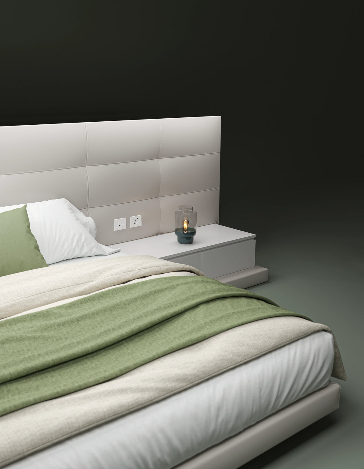 Angled detail of the beige Sublime bed with rectangular tufted cladding, an integrated nightstand, and green bedding.
