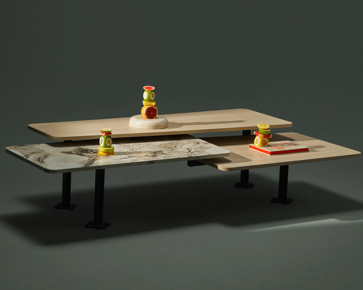 Trio three-tier coffee table featuring overlapping wood veneer and marble laminate surfaces at different heights.